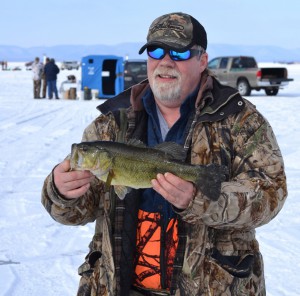 Ed Slimen of Taylor, Wis. caught this 18-inch largemouth bass during the Atomic Ice Derby