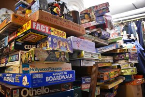 Piles of old board games await potential players in Hunt’s antique shop.