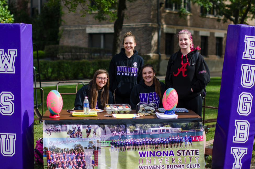 Clubs at Winona State are required to take part in the fall club fair to maintain active club status, in addition to other ASO requirements. The women’s rugby team is one of 29 sports clubs that also need to follow Sports Club Council regulations. (Photo by Ka Vang, Winona State University Communications)
