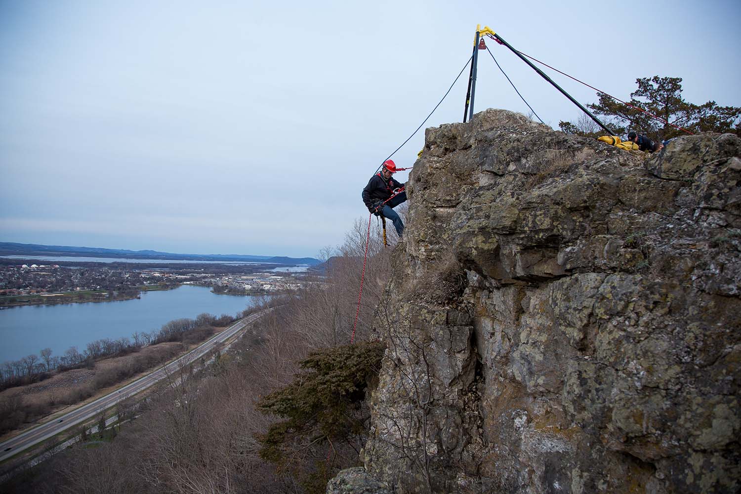 Winona firefighter Charlie Casperson rappels from the west side of Garvin Heights’ scenic lookout using the Arizona Vortex to retrieve a sofa that was thrown over the edge. The team of firefighters and park maintenance crewmembers picked up trash from the lookout on Wednesday, April 5.
