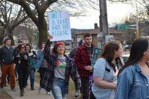 Participants of Take Back the Night begin the march through downtown Winona.