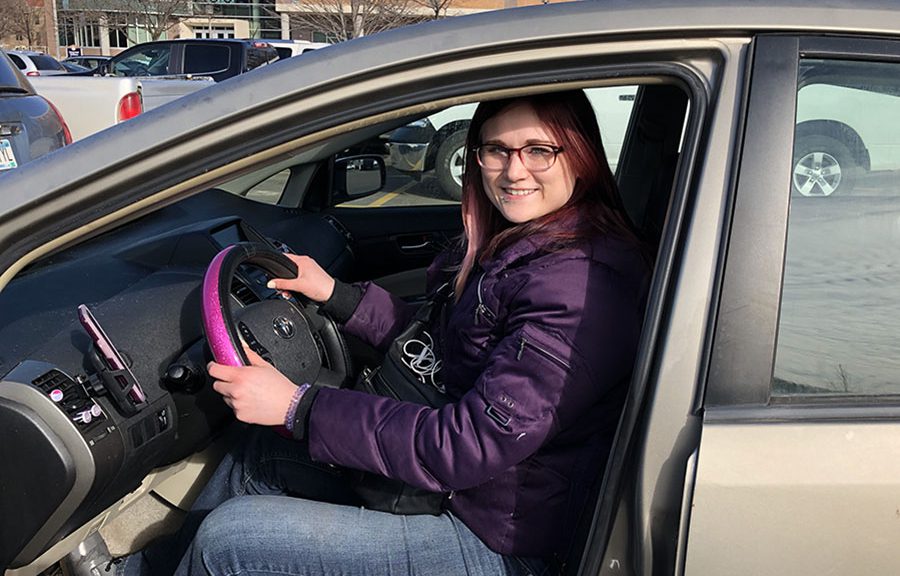 A Winona State student in driver's seat of her Lyft vehicle