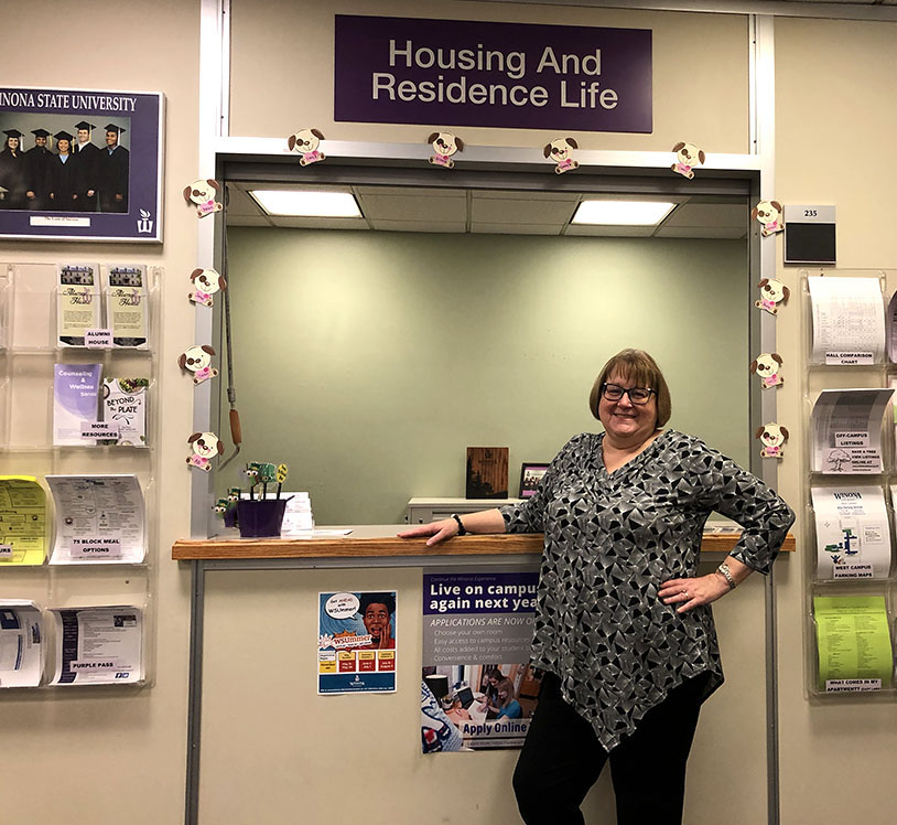 Paula Scheevel posing in her office space for housing and residence life